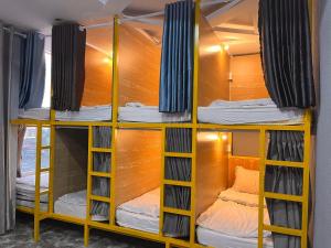 a group of bunk beds in a room at King Kong hostel in Da Lat