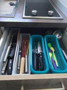 a drawer filled with plastic containers and utensils at UNIaparts in Regensburg