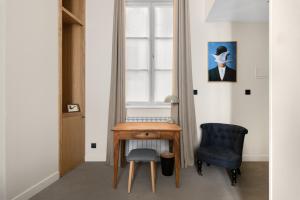 Posezení v ubytování Le Phénix Hôtel
