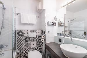 Phòng tắm tại Hotel Calmo