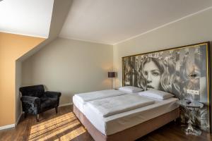 Giường trong phòng chung tại Hotel Calmo
