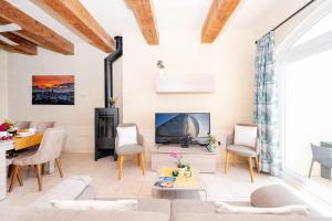 a living room with a couch and a fireplace at Veduta Holiday Home in Qala