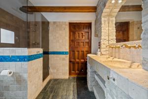 a bathroom with two sinks and a shower at Can tronc in Querol +36 photos