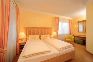 Кровать или кровати в номере Vitalhotel Sonneck