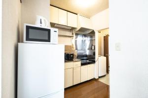 Η κουζίνα ή μικρή κουζίνα στο Furano Farm Tomita Condo