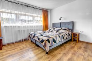 Łóżko lub łóżka w pokoju w obiekcie Willa Wladyslaw - centrum Krynicy, parking w cenie!