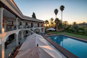 a view of a house with a swimming pool at El palacete in Estepona