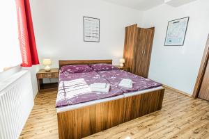 Postel nebo postele na pokoji v ubytování Penzion Černý Sklep