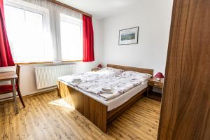 Postel nebo postele na pokoji v ubytování Penzion Černý Sklep