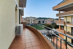 a balcony with a view of a city at Appartamento Galileo Deluxe - MyHo Casa in Tortoreto Lido