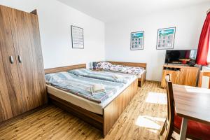 Postel nebo postele na pokoji v ubytování Penzion Černý Sklep