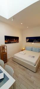 a bedroom with a large bed in a room at BARBARA Classy Apartment 101 in Siracusa