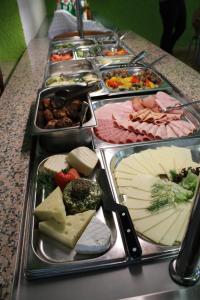 a long buffet of cheese and meats on a table at DEULA Witzenhausen GmbH in Witzenhausen