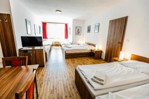 Postel nebo postele na pokoji v ubytování Penzion Černý Sklep