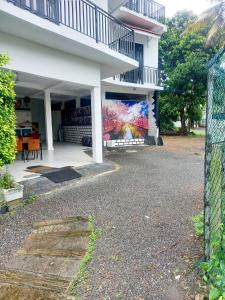 a building with a mural on the side of it at Changami Residence in Nugegoda