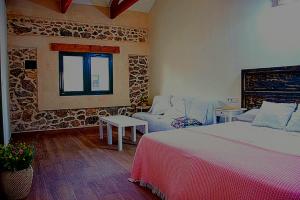 Postel nebo postele na pokoji v ubytování Ecoturismo Cabo Tiñoso
