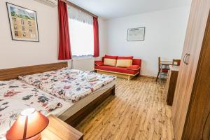 Postel nebo postele na pokoji v ubytování Penzion Černý Sklep