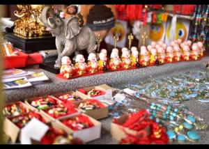 a display of beads and an elephant figurine on a table at PATHI BUNKERS in Darjeeling