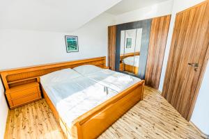 Postel nebo postele na pokoji v ubytování Penzion Černý Sklep