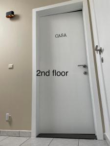 a white door with the words gaia and floor on it at Casa Christel in Mechelen