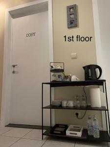 a white door with a list floor sign on it at Casa Christel in Mechelen