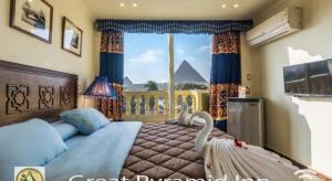 TV a/nebo společenská místnost v ubytování Great Pyramid Inn