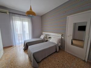Postel nebo postele na pokoji v ubytování Alloggio Claudia - Valpo39 + 18 fotografií