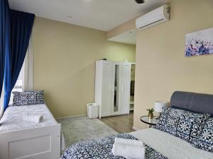 a bedroom with a bed and a dresser in it at Oasisstay 3 Bedrooms Apartment Bangi Sentral in Kampong Sungai Ramal Dalam