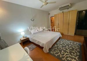 a bedroom with a bed and a table at Jacuzzi Pool Villa Isabelle 1bed in Nathon Bay