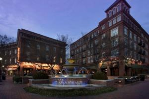 a town square with a fountain in front of buildings at Hampton Inn Huntsville/Village of Providence, AL in Huntsville