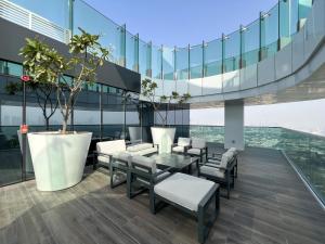 a dining area on the top of a building at LUXE 2BR at 1 RESIDENCES WASL NEAR METRO STATION in Dubai
