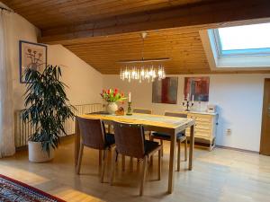 a dining room with a table and chairs at Haus Irmgard in Bad Endorf