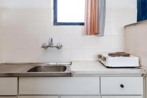 a kitchen with a sink and a toaster on a counter at 5 Kypri Seaview Perasma Studio in Kypri +14 photos