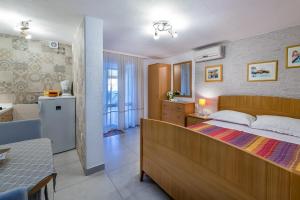 Postel nebo postele na pokoji v ubytování Apartments Nadica