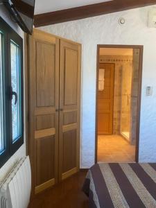 a bedroom with a door leading to a hallway at A Casa di Furtunatu in Santa-Reparata-di-Balagna