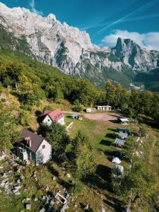 an aerial view of a village in the mountains at Guesthouse Freskia in Theth