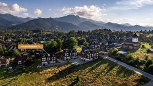 an aerial view of a small town in the mountains at Apartamenty Sun & Snow Pardałówka in Zakopane