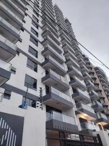 a tall building with balconies on the side of it at New 2 & 3 bedroom Apartment in Kilimani Nairobi with rooftop pool in Nairobi