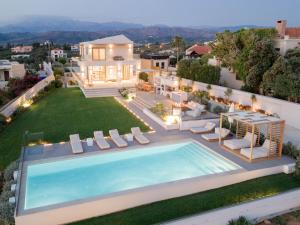 an aerial view of a house with a swimming pool at Centro Golden View Villa in Chania