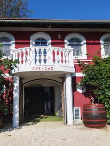 an entrance to an art lab with a white balcony at ARK-LAK 