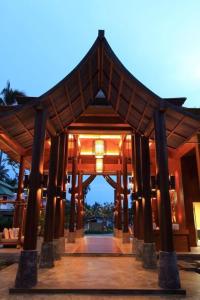 a wooden pavilion with a light on top of it at Deva Beach Resort Samui in Choeng Mon Beach