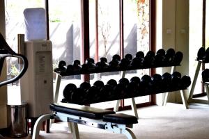 a gym with a rack of boxing equipment at Deva Beach Resort Samui in Choeng Mon Beach