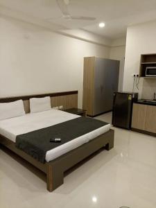 a bedroom with a large bed in a room at The Embassy Suites in Hyderabad