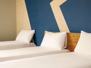Postel nebo postele na pokoji v ubytování ibis budget London Heathrow Central