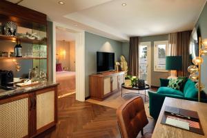 a living room with a couch and a room with a bed at Boho Club in Marbella
