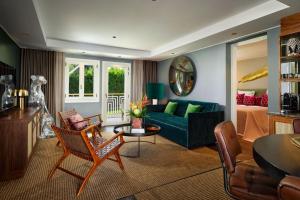 a living room with a couch and a table at Boho Club Marbella - a Preferred Hotel in Marbella