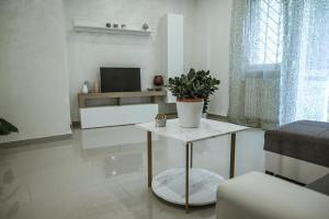 TV a/nebo společenská místnost v ubytování L'albero di Giada