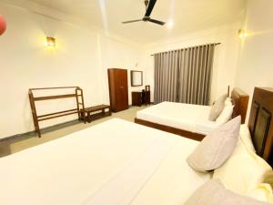 Letto o letti in una camera di Sunliya Resort