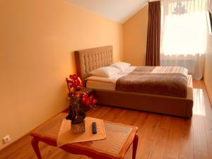Postel nebo postele na pokoji v ubytování SPA&Hotel MŪSA PARADISE