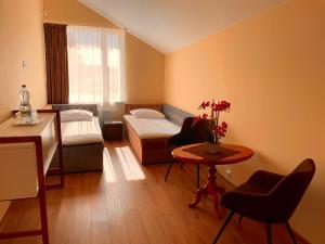 Postel nebo postele na pokoji v ubytování SPA&Hotel MŪSA PARADISE